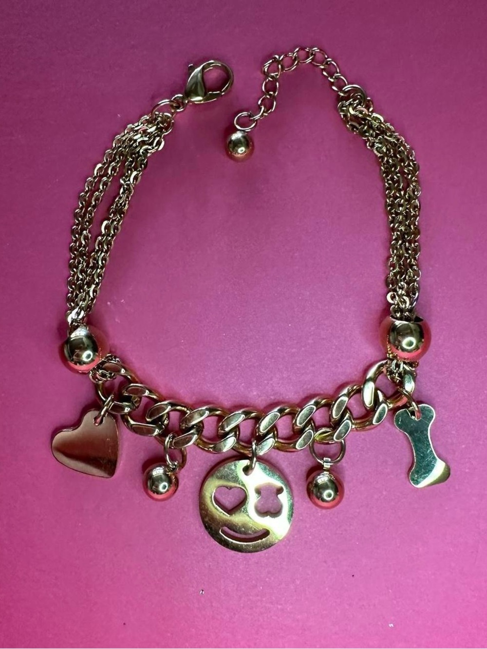 Golden chain charm bracelet.